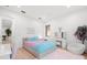 Stylish bedroom with a pink rug, plush chair, and a window that lets in plenty of natural light at 3105 S Schiller St, Tampa, FL 33629