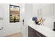 Clean entryway featuring white walls, built-in storage, a window, and a digital display at 3105 S Schiller St, Tampa, FL 33629
