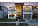 Stunning modern home with large windows, a balcony, a two-car garage, and immaculate landscaping at 3105 S Schiller St, Tampa, FL 33629