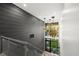 Second story shot of the bright foyer featuring modern lighting and stairs at 3105 S Schiller St, Tampa, FL 33629