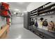 A spacious garage featuring ample storage with cabinets, shelves, and an epoxy floor at 3105 S Schiller St, Tampa, FL 33629