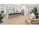 Bright open-concept kitchen featuring a large island, stainless steel appliances, and modern design at 3105 S Schiller St, Tampa, FL 33629