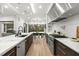 Elegant kitchen with marble countertops, stainless steel appliances, and a view of the dining area at 3105 S Schiller St, Tampa, FL 33629