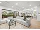 Spacious living room showcasing open layout, large sectional sofa, and seamless indoor-outdoor living at 3105 S Schiller St, Tampa, FL 33629