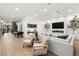Bright living room features a modern fireplace, a full bar, and a pool table for entertaining at 3105 S Schiller St, Tampa, FL 33629