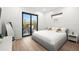 Bright main bedroom with hardwood floors and balcony access at 3105 S Schiller St, Tampa, FL 33629