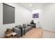 Minimalist office design with gray sofa, white desk, and ample natural light at 3105 S Schiller St, Tampa, FL 33629