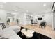 Open recreation room with contemporary furnishings, built-in sneaker display, and an adjacent seating area at 3105 S Schiller St, Tampa, FL 33629