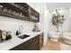 The wet bar is equipped with a stylish sink and a beverage cooler for your convenience at 3105 S Schiller St, Tampa, FL 33629
