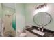 This bathroom features a vanity with granite countertops and a mirror at 3208 Stevenson St, Plant City, FL 33566