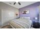 This bedroom features a ceiling fan, closet, and comfortable bedding, perfect for relaxation at 3208 Stevenson St, Plant City, FL 33566