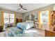 Bedroom with wooden ceiling fan and an area rug at 3208 Stevenson St, Plant City, FL 33566