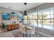 Cozy dining area with pool view, stylish decor, and a modern pendant light at 3208 Stevenson St, Plant City, FL 33566