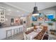 Open-concept dining area with a pool view, seamlessly connected to the kitchen at 3208 Stevenson St, Plant City, FL 33566