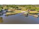 A picturesque lake view featuring a gazebo, a dock, and serene water, offering a tranquil and scenic setting at 3208 Stevenson St, Plant City, FL 33566