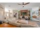 Spacious living area with stylish decor, a ceiling fan, and an open floor plan at 3208 Stevenson St, Plant City, FL 33566