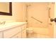 Bathroom with white vanity, tile flooring, and a shower-tub combination with grab bars at 3358 Mermoor Dr # 2106, Palm Harbor, FL 34685