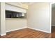 Open dining area next to the kitchen, featuring hardwood flooring and a breakfast bar at 3358 Mermoor Dr # 2106, Palm Harbor, FL 34685