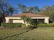 Exterior view of home with manicured hedges at 3358 Mermoor Dr # 2106, Palm Harbor, FL 34685
