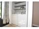 Laundry closet featuring a full size washer and dryer, as well as storage shelves at 3358 Mermoor Dr # 2106, Palm Harbor, FL 34685