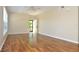 Spacious living room featuring hardwood floors, neutral walls, and a ceiling fan at 3358 Mermoor Dr # 2106, Palm Harbor, FL 34685