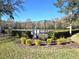 The community sign 'Ridgemoor Central Park' marks the entrance to the neighborhood tennis courts at 3358 Mermoor Dr # 2106, Palm Harbor, FL 34685