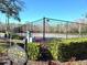 The community tennis courts features a 'Resident's Only' sign, with newly resurfaced surface surrounded by greenery at 3358 Mermoor Dr # 2106, Palm Harbor, FL 34685