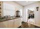 Charming wet bar featuring sleek cabinets and a wine display area, ideal for entertaining guests at 3612 Sugar Loaf Ln, Valrico, FL 33596