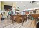 Entertainment area featuring a wood-paneled bar, ample seating, nautical decor and mini-refrigerator at 3612 Sugar Loaf Ln, Valrico, FL 33596