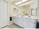 Bathroom featuring a double vanity with a large mirror, and stylish fixtures at 3612 Sugar Loaf Ln, Valrico, FL 33596