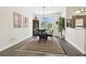 The dining room features luxury vinyl floors, neutral paint and large windows at 3612 Sugar Loaf Ln, Valrico, FL 33596