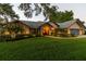 Well-maintained house with landscaped lawn, walkway, and an attached three-car garage at 3612 Sugar Loaf Ln, Valrico, FL 33596