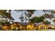 Beautiful single-story home with manicured lawn, brick accents, and professional outdoor lighting at 3612 Sugar Loaf Ln, Valrico, FL 33596