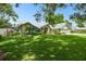 Charming single-Gathering home with a lush green lawn and mature trees at 3612 Sugar Loaf Ln, Valrico, FL 33596