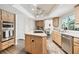 Bright kitchen features wood cabinets, an island cooktop and stainless steel appliances at 3612 Sugar Loaf Ln, Valrico, FL 33596