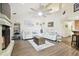 This living room features a fireplace, luxury vinyl floors and neutral paint at 3612 Sugar Loaf Ln, Valrico, FL 33596