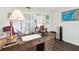 Home office with a dark wood desk with drawers and cabinets on wood floors at 3612 Sugar Loaf Ln, Valrico, FL 33596