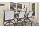 Outdoor patio bar with three comfortable barstools for entertaining at 3612 Sugar Loaf Ln, Valrico, FL 33596