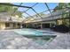 Backyard featuring a screened-in pool, covered lanai, and lots of room to relax at 3612 Sugar Loaf Ln, Valrico, FL 33596