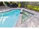 Screened-in pool area with spa featuring a paver surround and lush landscaping at 3612 Sugar Loaf Ln, Valrico, FL 33596