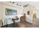 Interior view of a sewing room with dark wood floors and white walls at 3612 Sugar Loaf Ln, Valrico, FL 33596