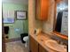 Bathroom with walk-in shower, modern vanity, and decorative mirror at 4116 Cardoon Dr, New Port Richey, FL 34653