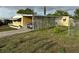 Exterior of property with driveway, carport, and some greenery at 4116 Cardoon Dr, New Port Richey, FL 34653