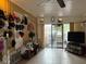 Spacious living room featuring tile flooring, fan, and lots of light at 4116 Cardoon Dr, New Port Richey, FL 34653