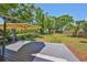 Expansive backyard with a wooden deck and lush green grass, perfect for outdoor activities at 609 4Th Sw Ave, Ruskin, FL 33570