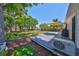 Large backyard with a wooden deck, mature trees, and a swing, ideal for relaxation and recreation at 609 4Th Sw Ave, Ruskin, FL 33570
