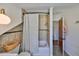 Updated bathroom with a shower-tub combo, tiled walls, and convenient storage at 609 4Th Sw Ave, Ruskin, FL 33570