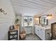 Bright white bathroom with a vanity, basket accents, and a sunlit window at 609 4Th Sw Ave, Ruskin, FL 33570