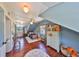 Cozy blue bedroom with hardwood floors, white ceiling, bed, and bright, natural light at 609 4Th Sw Ave, Ruskin, FL 33570