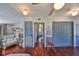 Sitting area with a plush armchair and adjacent reading area, plus built in bookshelves at 609 4Th Sw Ave, Ruskin, FL 33570